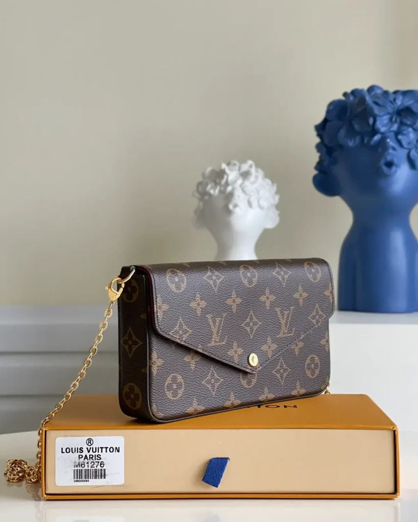 Brown Monogram Envelope Chain Pouch — three quarter view