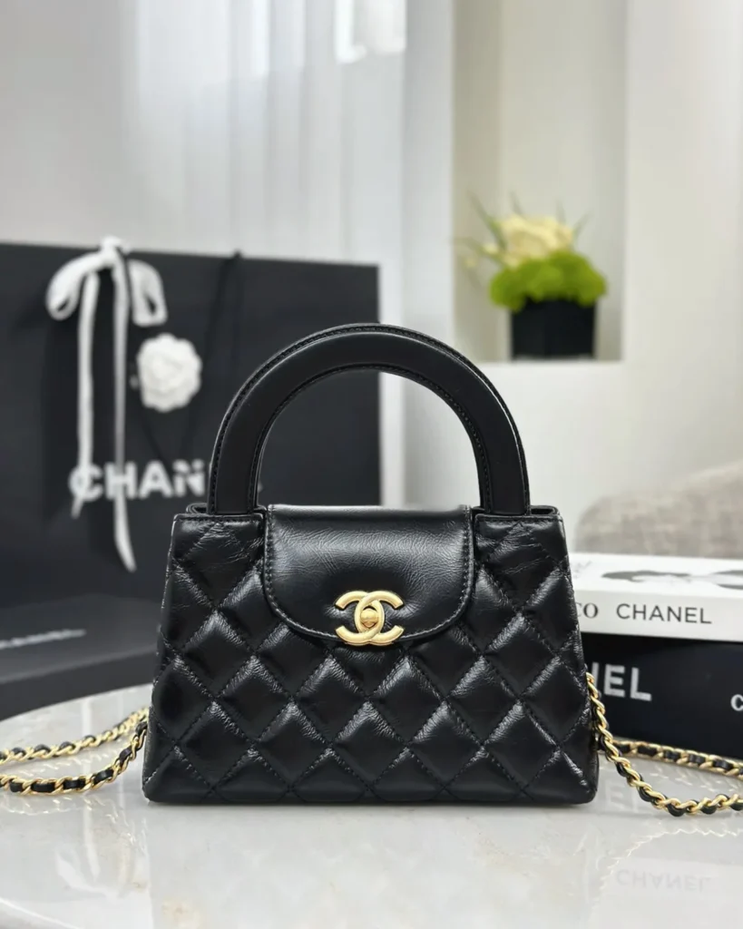 Black Quilted Tab-Flap Top-Handle Bag — front view
