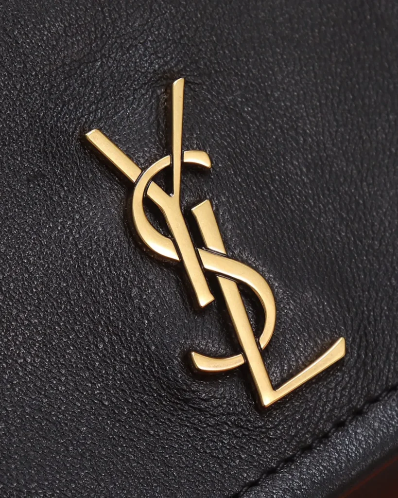 Black Diamond-Quilted Chain Flap Bag — logo detail view