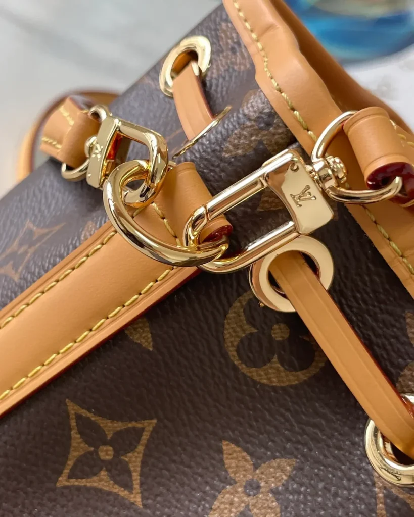 Brown Monogram Tan-Trim Drawstring Bucket Bag — clasp detail view