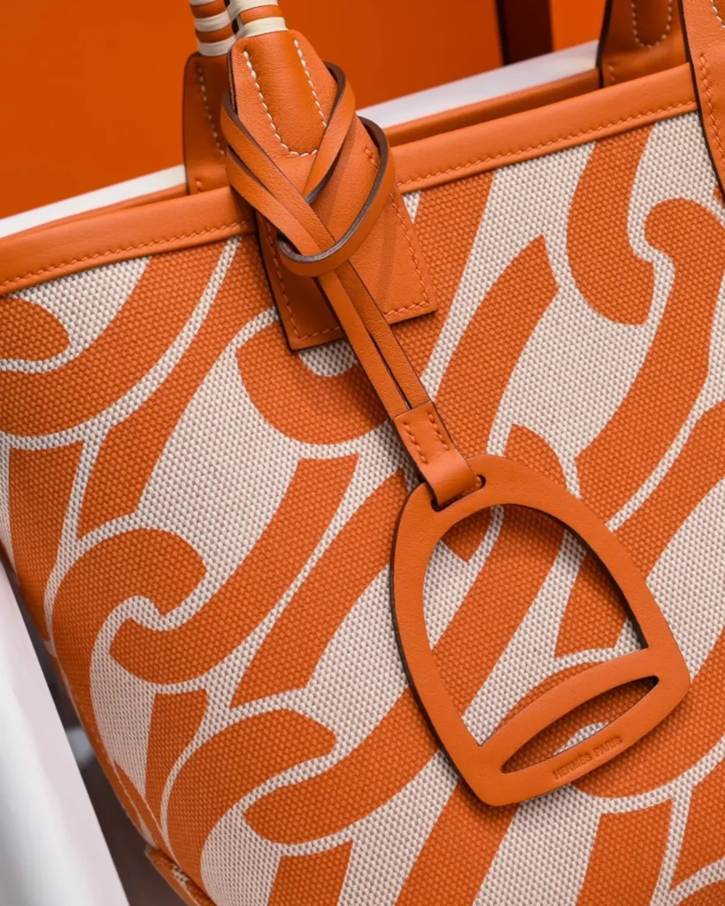 Steeple-Inspired Orange Patterned Canvas Tote, pendant detail view