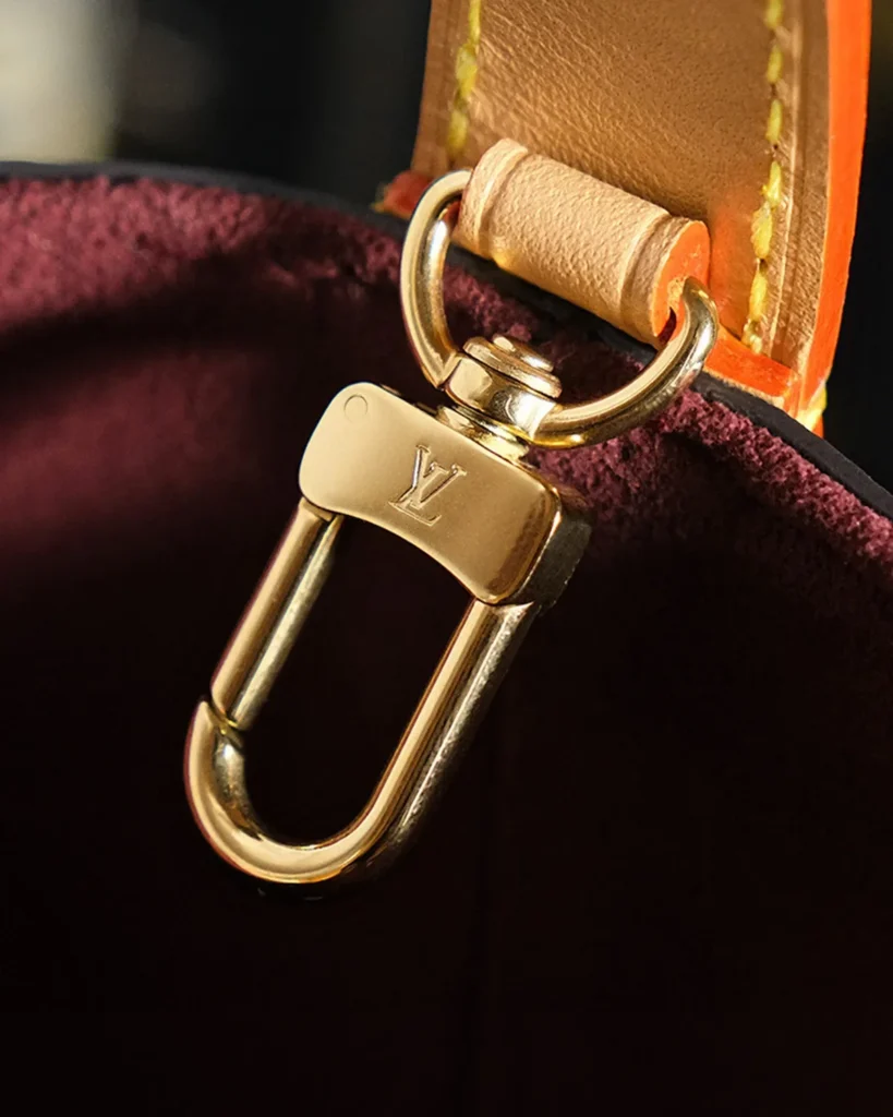 Brown Monogram Curved Top Bucket Bag — strap clip view