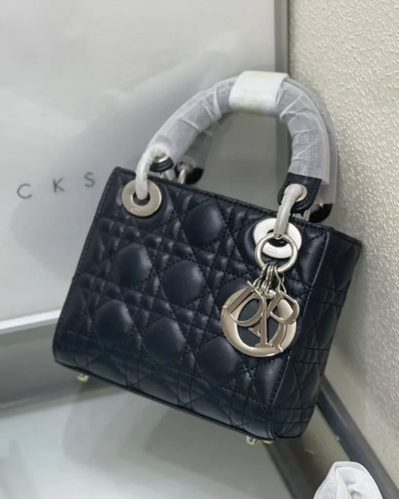 Black Quilted Top Handle Bag with Silver-Tone Charms — top view