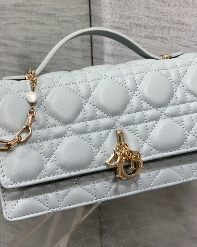 Pale Blue-Gray Quilted Top Handle Flap Bag — angled front view