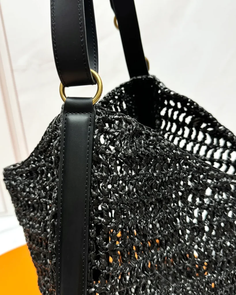 Black Open-Mesh Shoulder Bag — strap attachment view