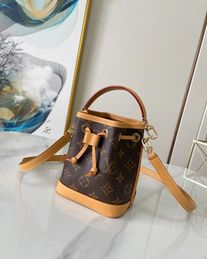 Brown Monogram Tan-Trim Drawstring Bucket Bag — three quarter view