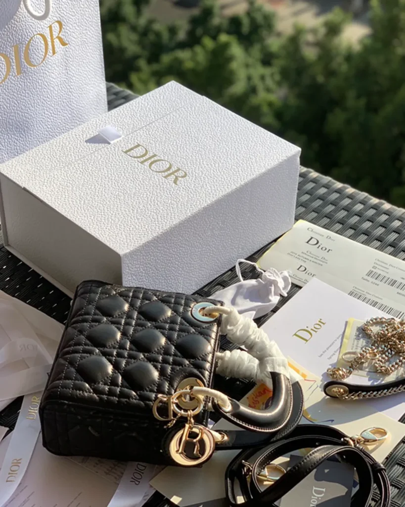 Black Quilted Compact Top Handle Bag — side view