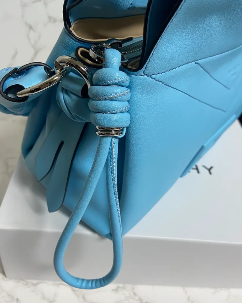 Blue Braided-Handle Flap Bag — handle knot