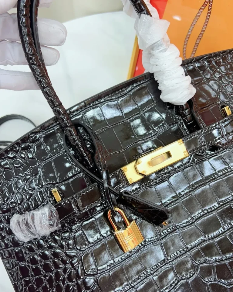 Black Glossy Scale-Texture Top-Handle Bag — closure view