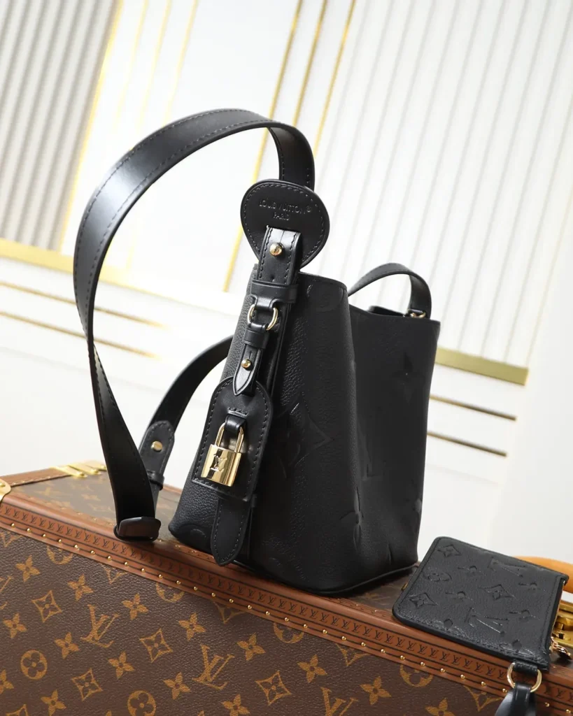 Black Embossed Monogram Bucket Bag — side view