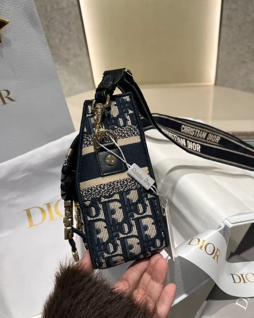 Navy Monogram Twin-Clasp Messenger Bag — side view