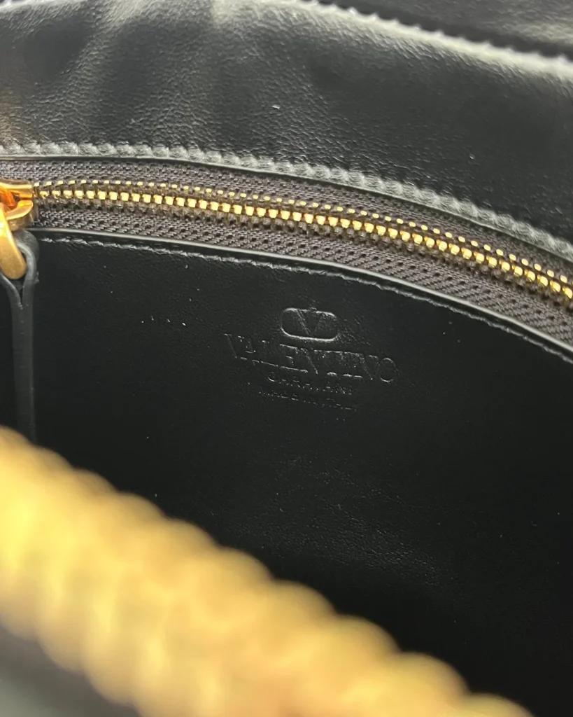Black and Tan V-Panel Top-Handle Bag — interior detail view