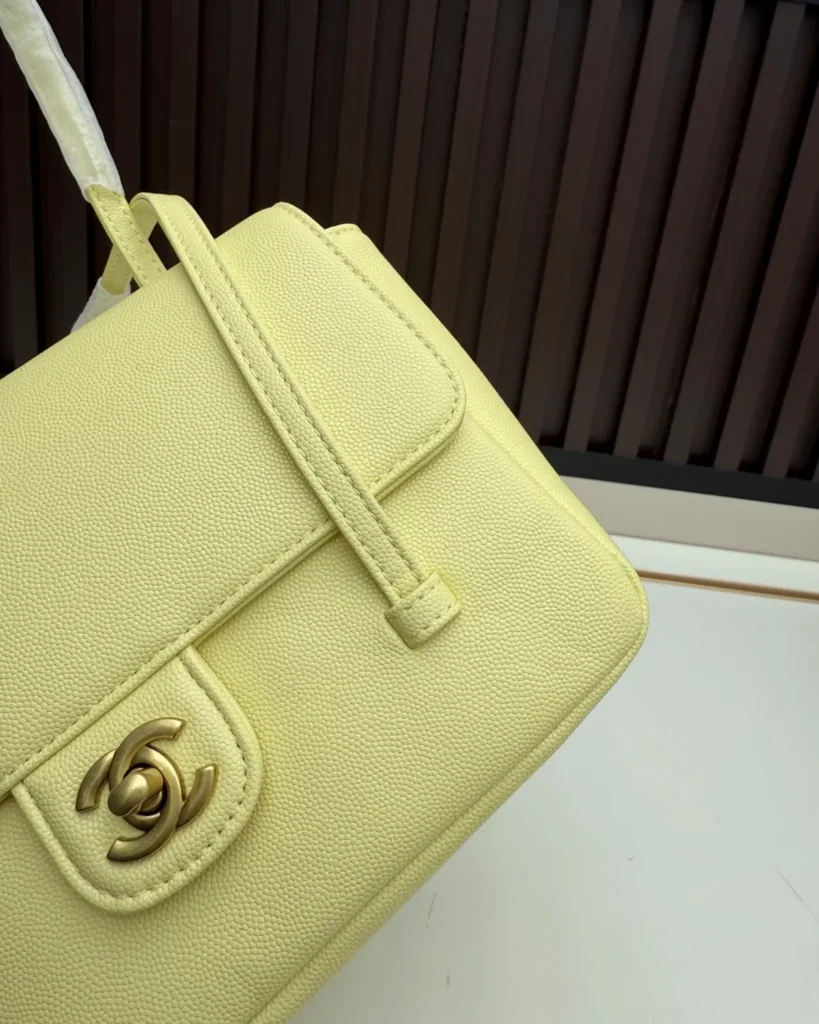Pale Yellow Long-Handle Flap Bag — handle detail view