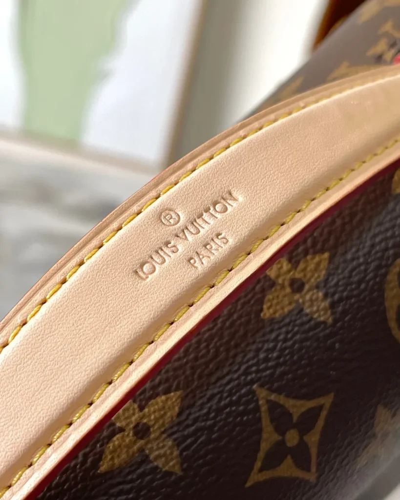 Brown Monogram Flap Satchel — handle detail view