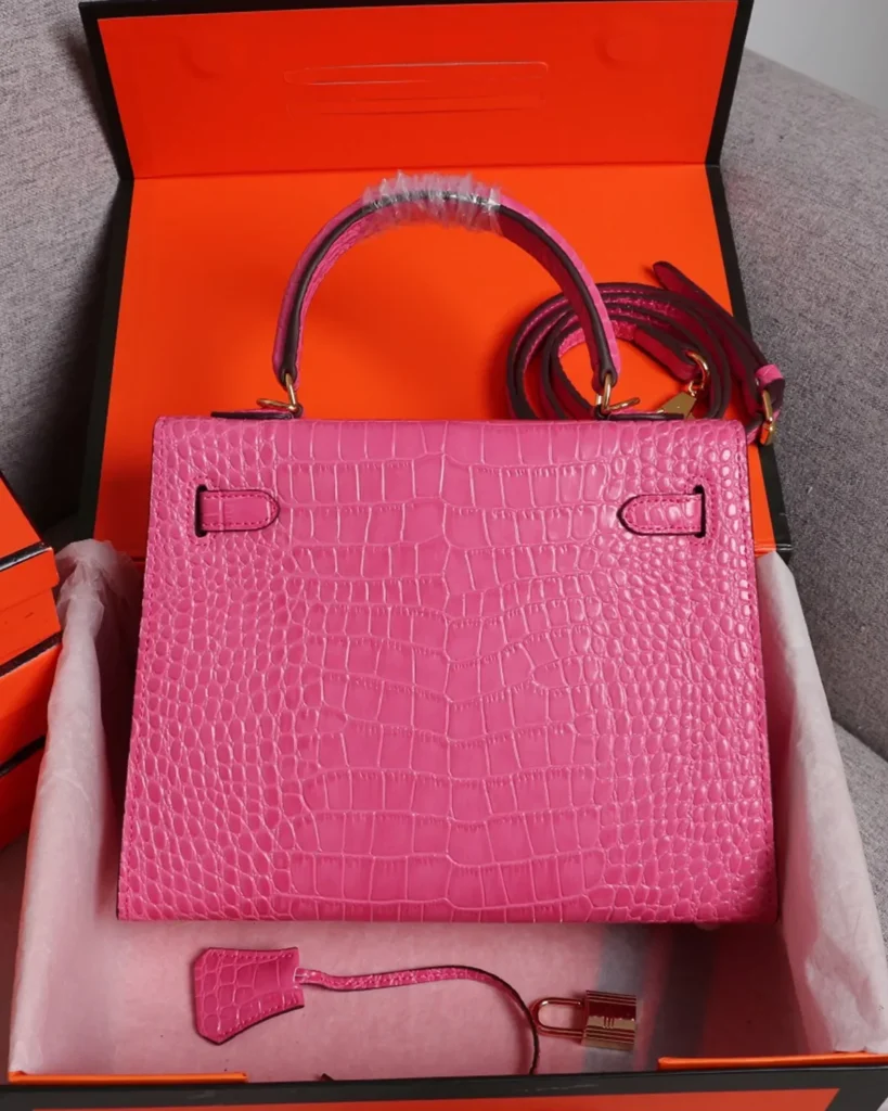 Kelly-Inspired Pink Croc-Pattern Top-Handle Bag, rear panel in box