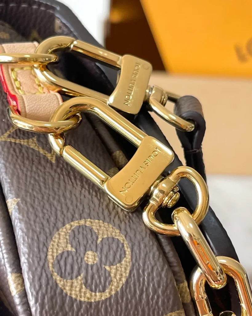 Brown Monogram East West Chain Satchel — chain clip view