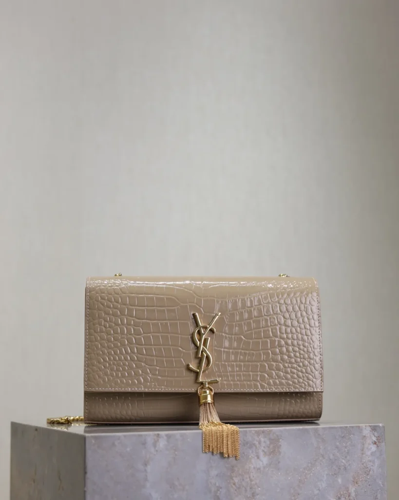 Taupe Embossed Tassel Chain Bag — front on plinth view