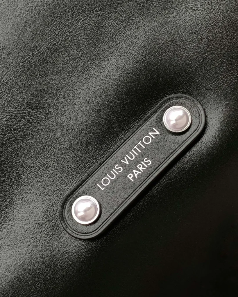 Black Slouchy Hobo Bag — front plaque view
