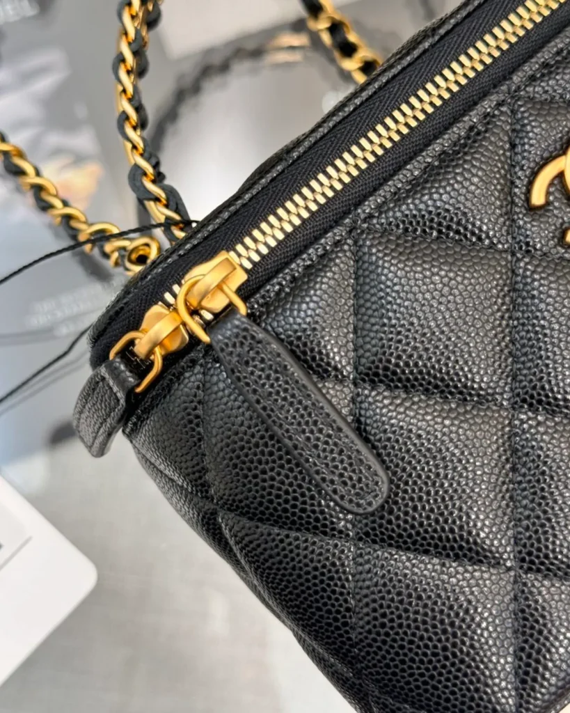 Black Quilted Chain-Handle Vanity Bag — zipper detail view