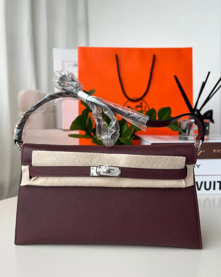 Burgundy structured shoulder bag, front view