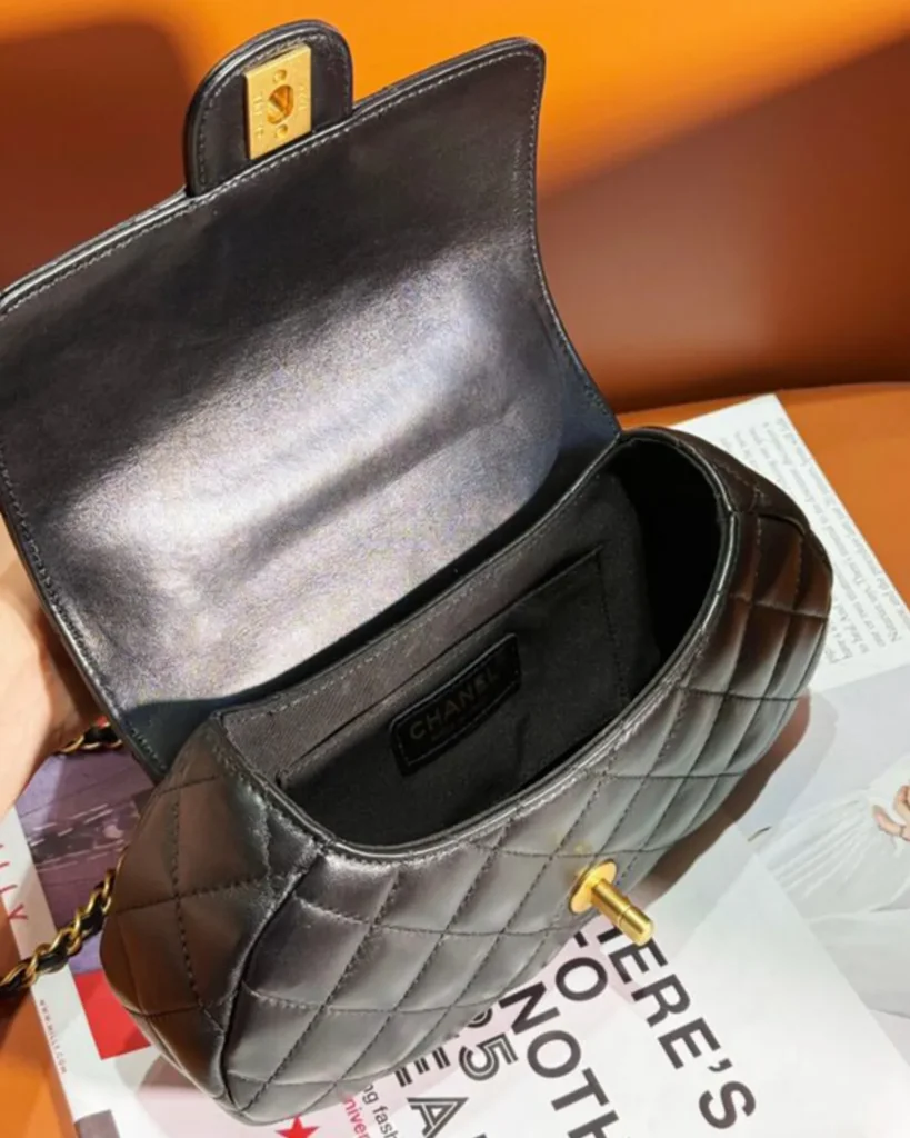Black Rounded Quilted Top-Handle Bag — interior angle view