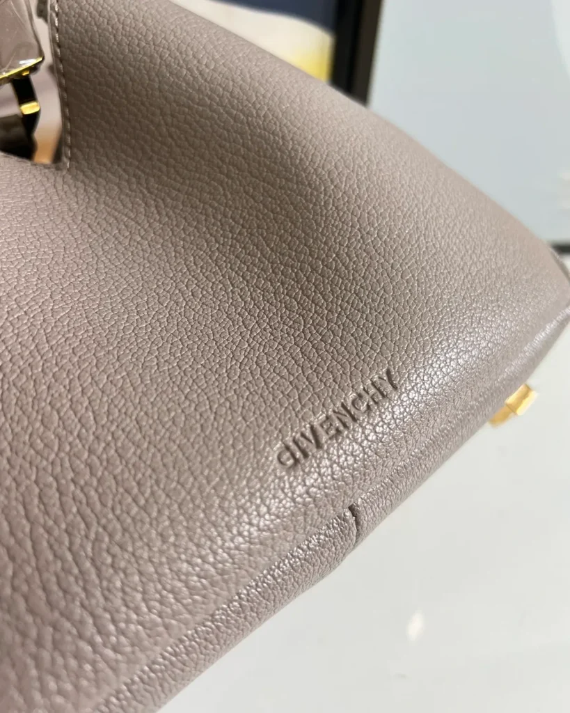 Taupe Sculptural Padlock Hobo — logo detail