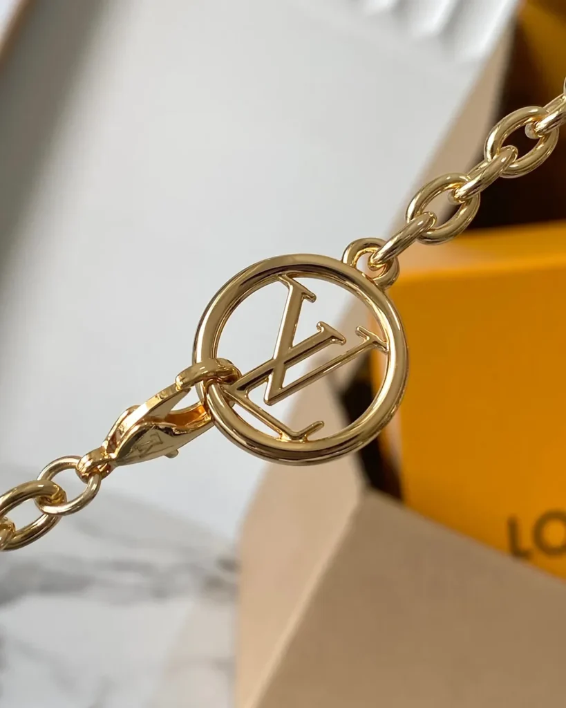 Brown Monogram Lily-Inspired Chain Wallet — chain charm detail view