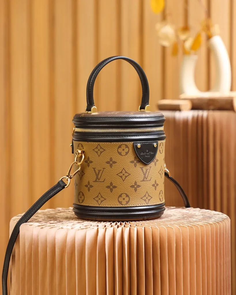 Tan Monogram Cylindrical Vanity Bag — angled view
