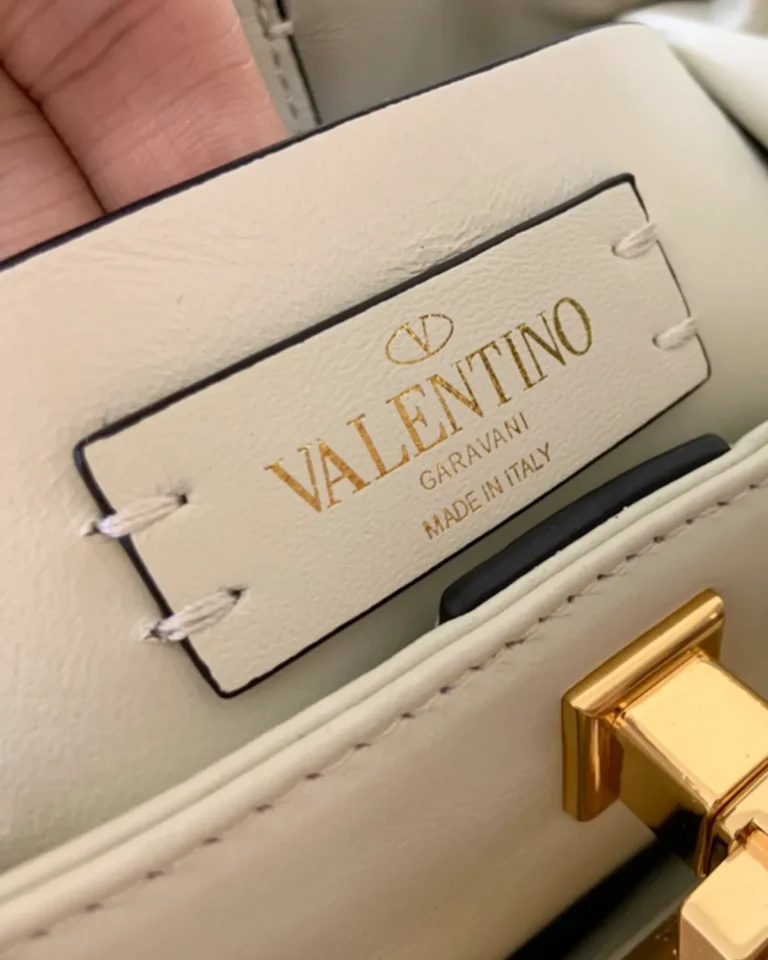 Ivory Diamond-Quilted Studded Top-Handle Bag — interior label view