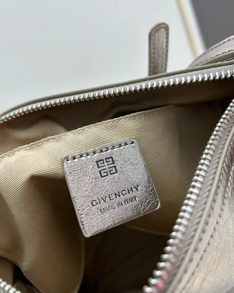 Metallic Silver Buckle Shoulder Bag — interior label view