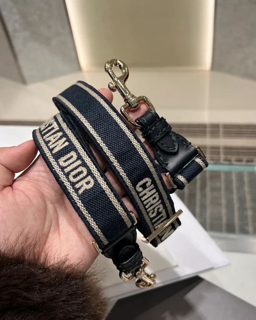 Navy Monogram Twin-Clasp Messenger Bag — strap detail view