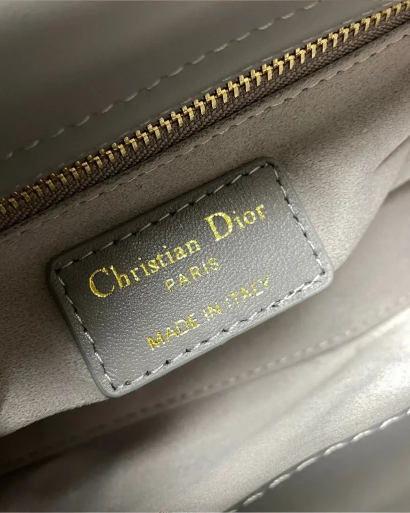 Gray Butterfly Stud Quilted Top Handle Bag — interior label view