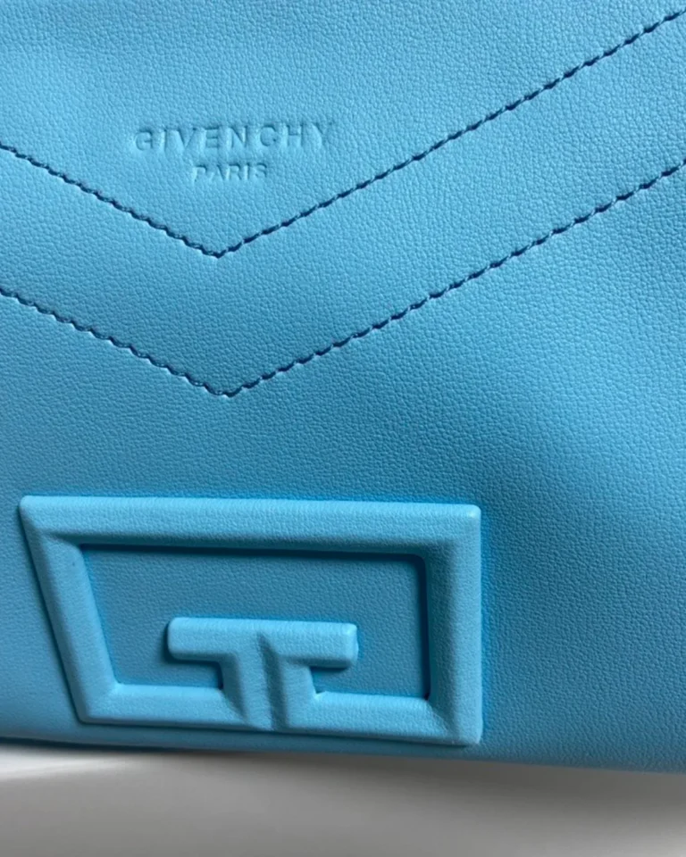 Blue Braided-Handle Flap Bag — clasp detail