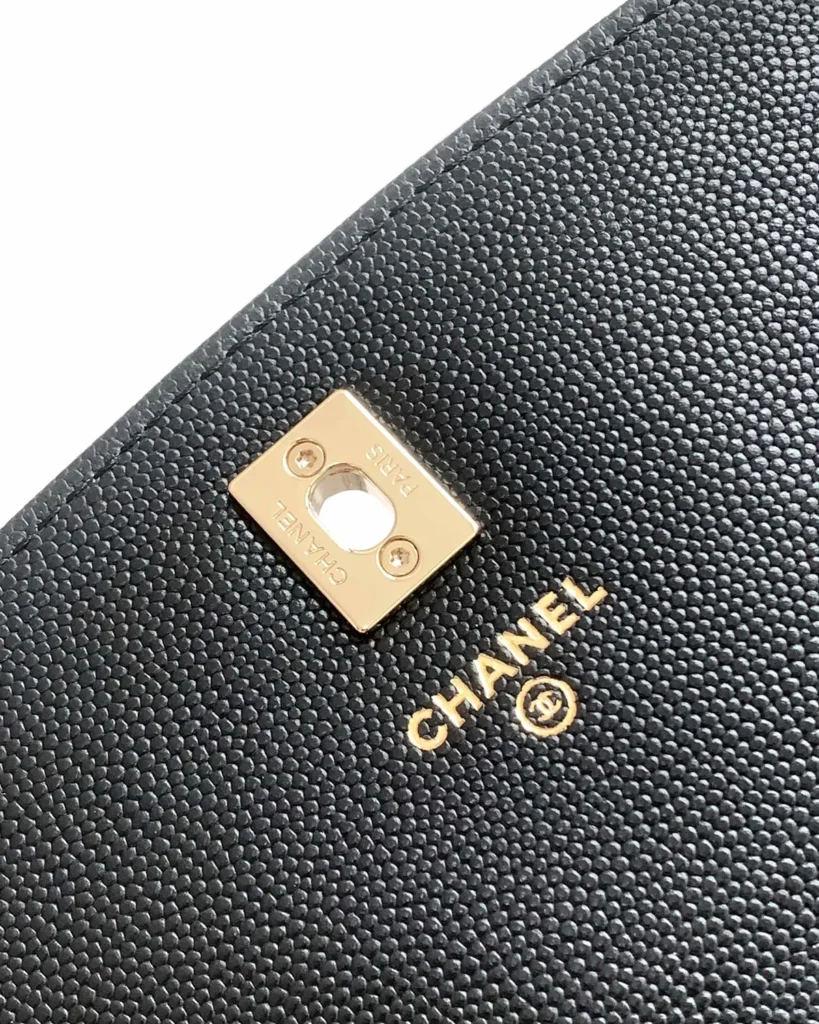 Black Quilted Top-Handle Chain Clutch — interior label view