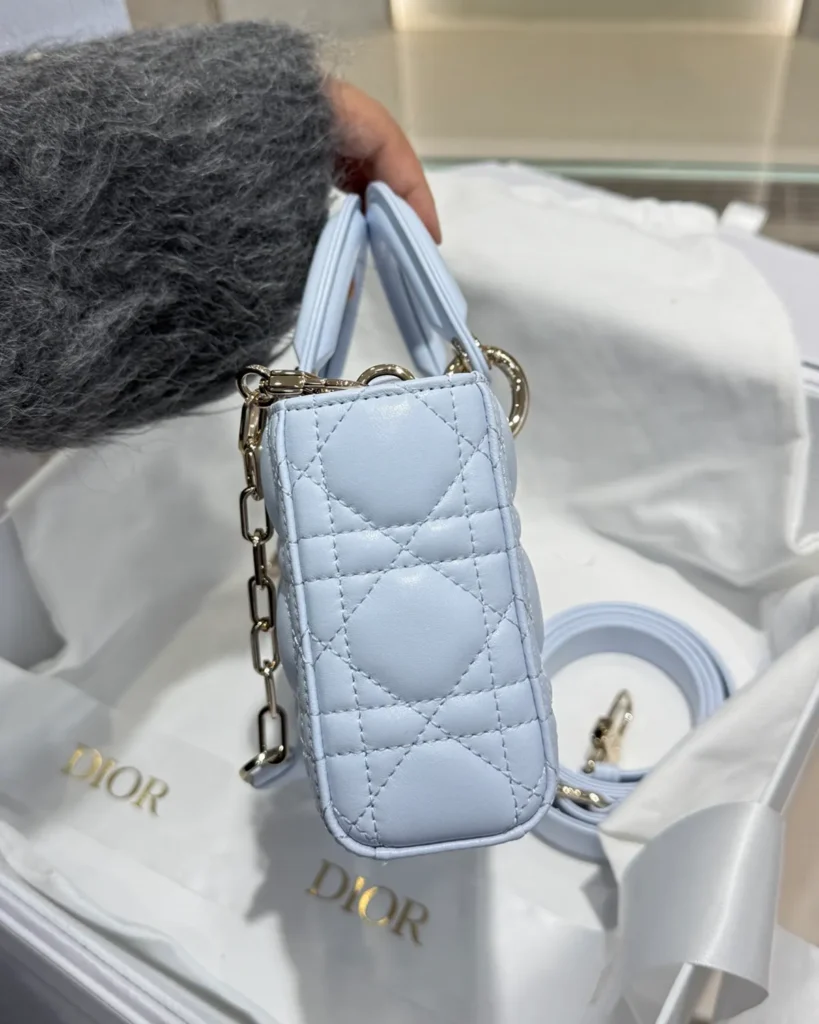 Pale Blue Horizontal Quilted Top Handle Bag — side view