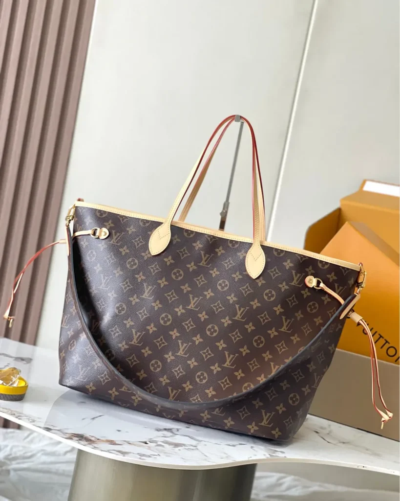 Beige Striped Stamp-Motif Reversible Tote — monogram front view