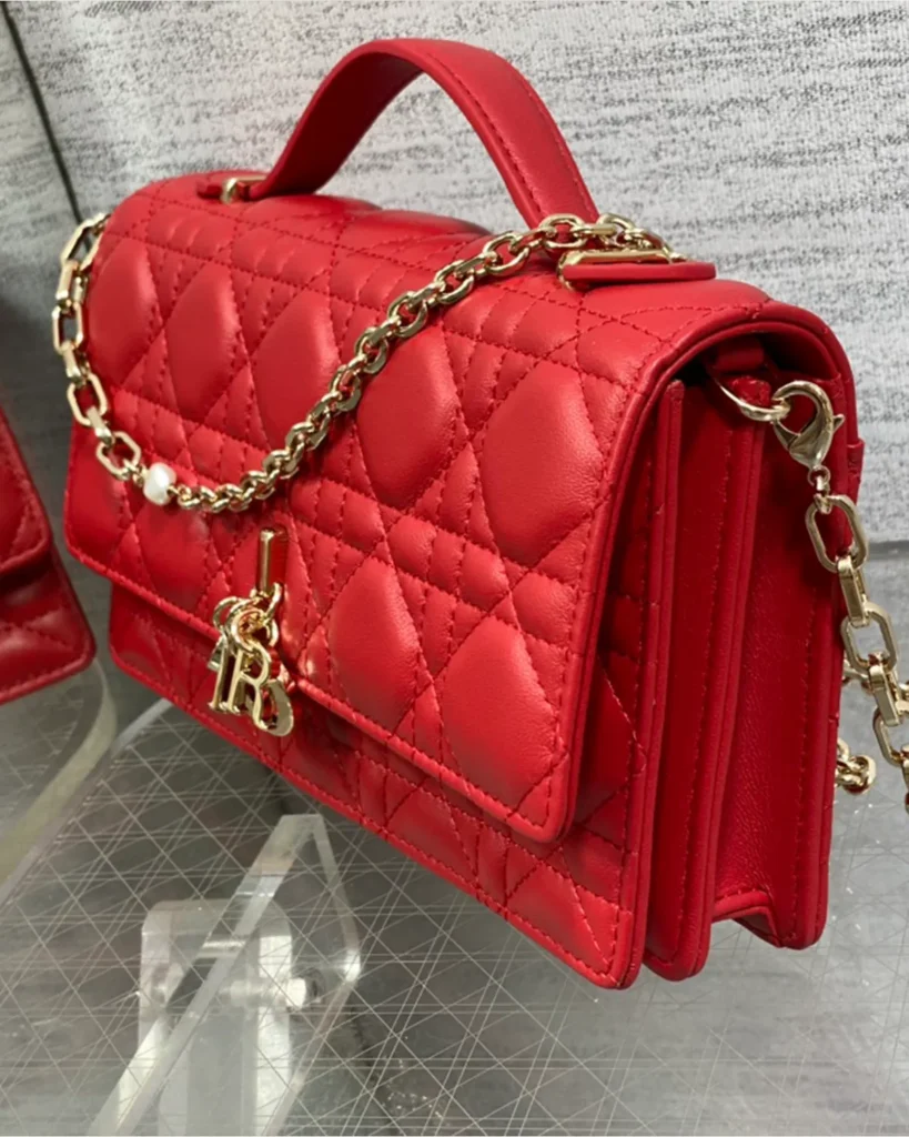 Red Quilted Top Handle Flap Bag — side view