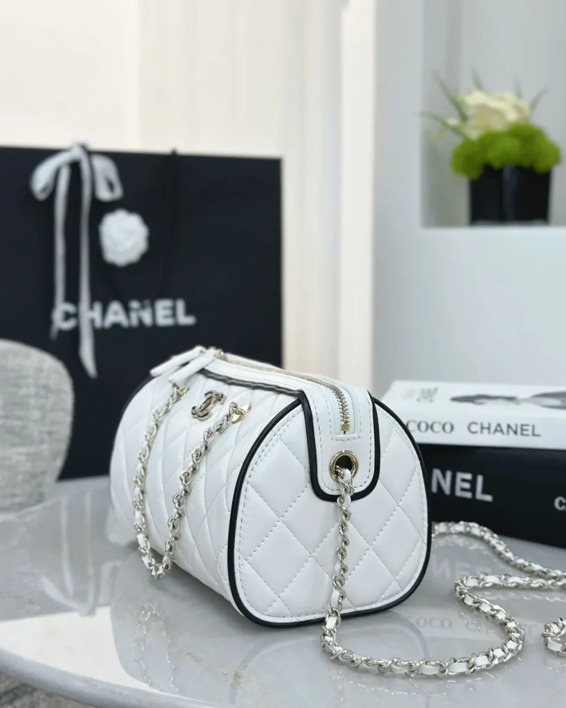 White and Black Quilted Chain Bowler Bag — side angle view