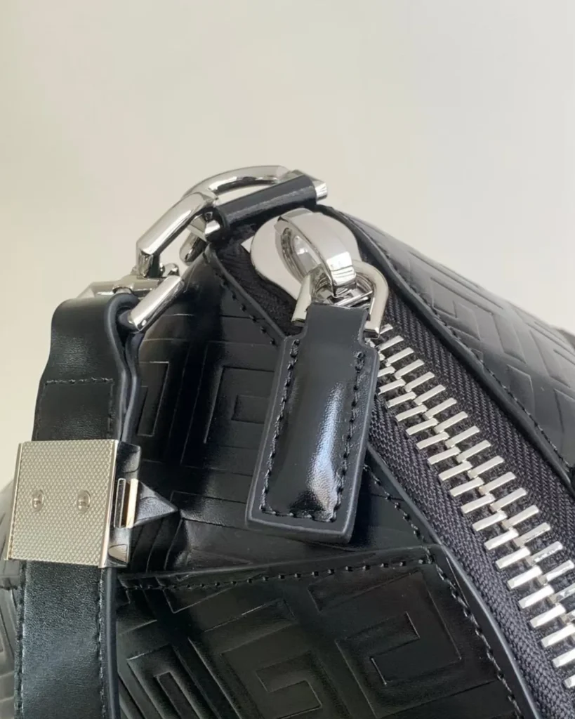 Black Geometric Embossed Twin-Handle Satchel — padlock detail