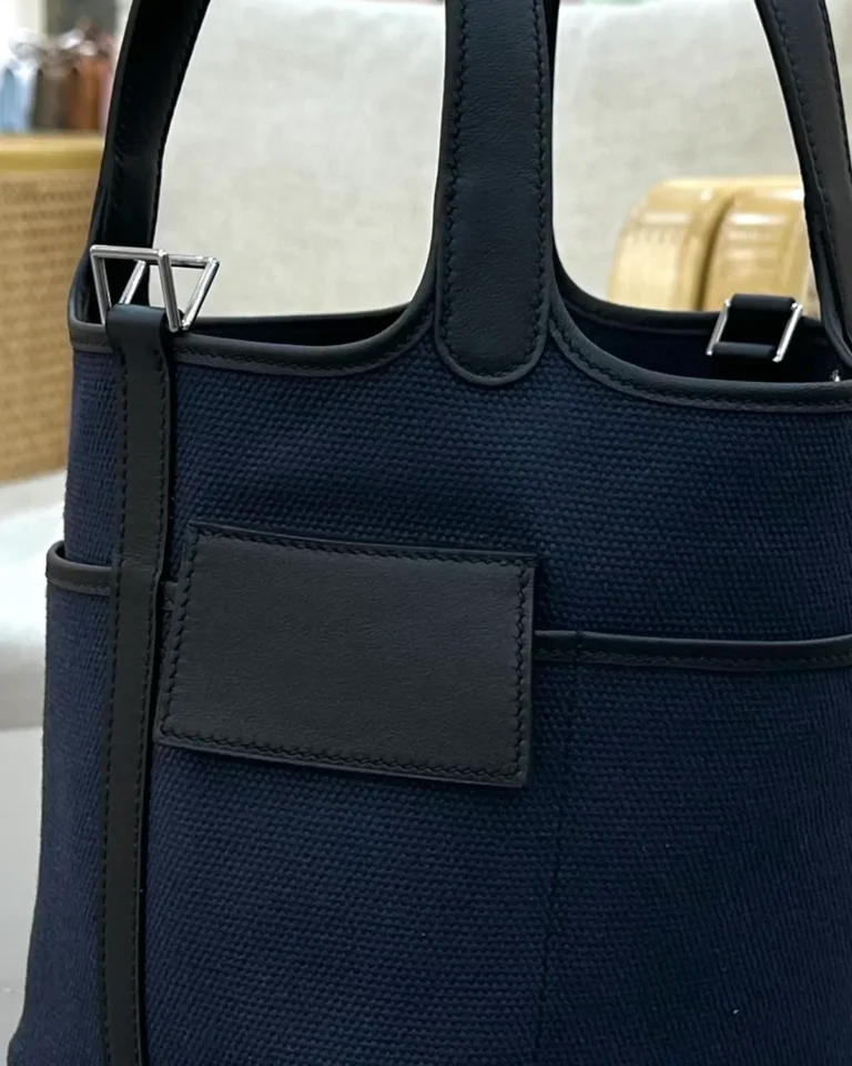 Picotin-Inspired Navy Textured Bucket Tote, hanging tag and front seam close-up